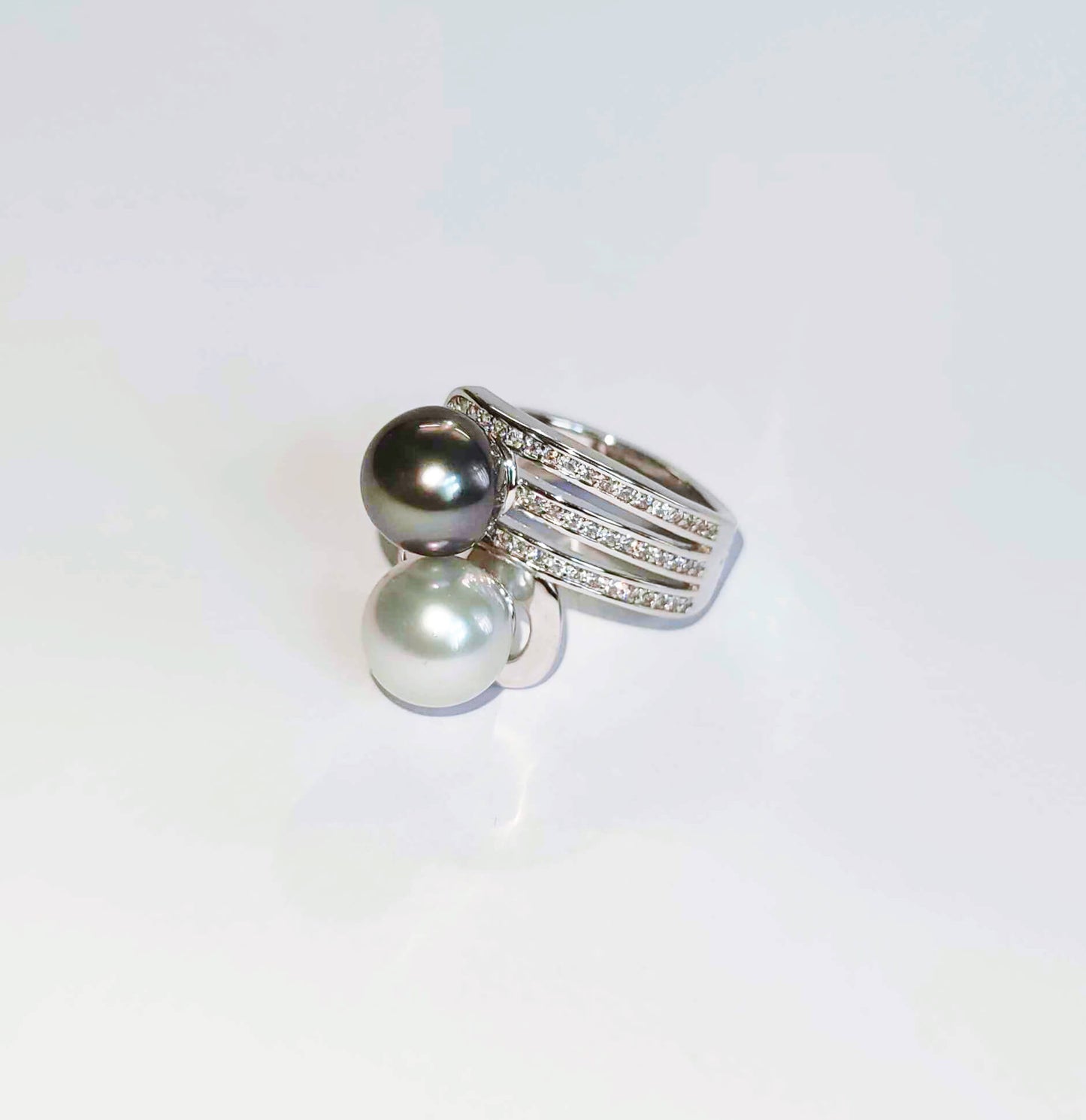 Silver Yin and Yang Ring with White and Black Sea Pearls and Zircons