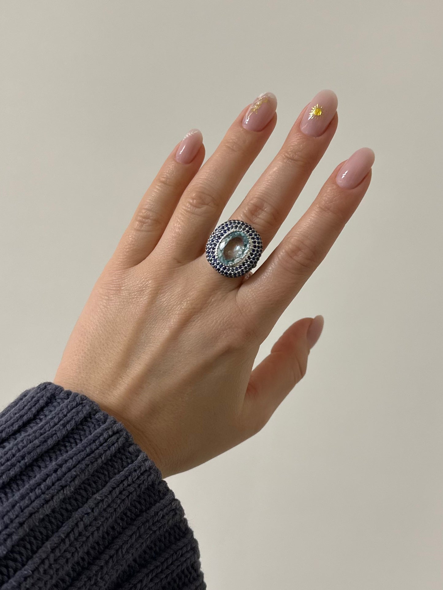 Sterling silver rhodium plated ring with aquamarine and blue sapphires