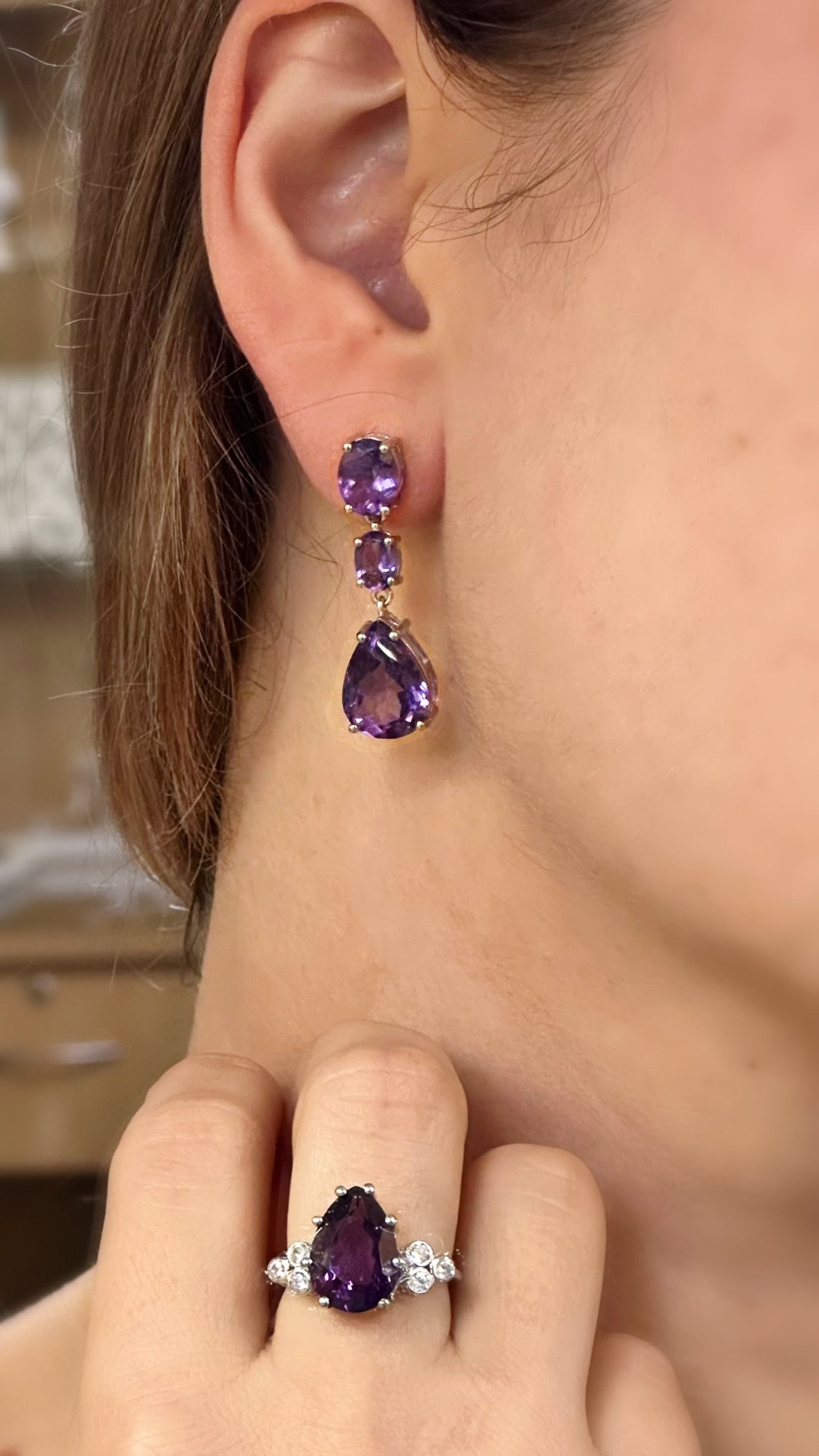 White rhodium plated sterling silver dangle earrings with natural amethysts