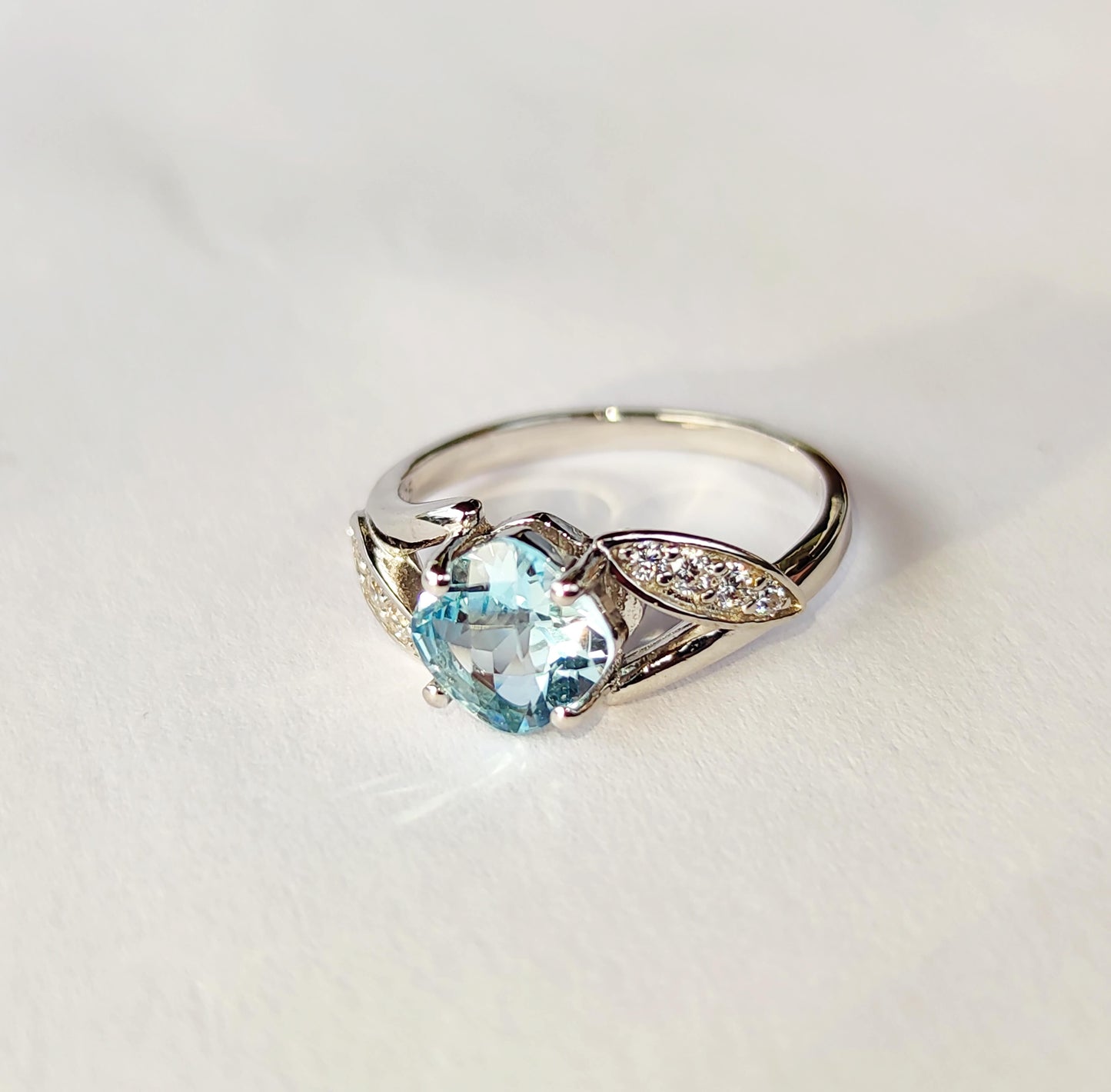 Silver Ring with Blue Topaz and Zircons