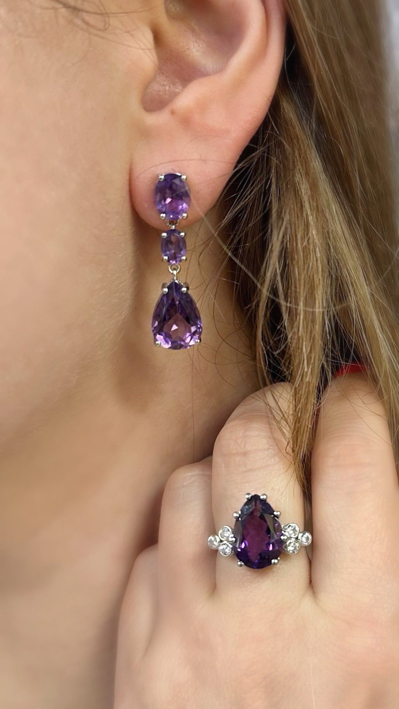 White rhodium plated sterling silver dangle earrings with natural amethysts