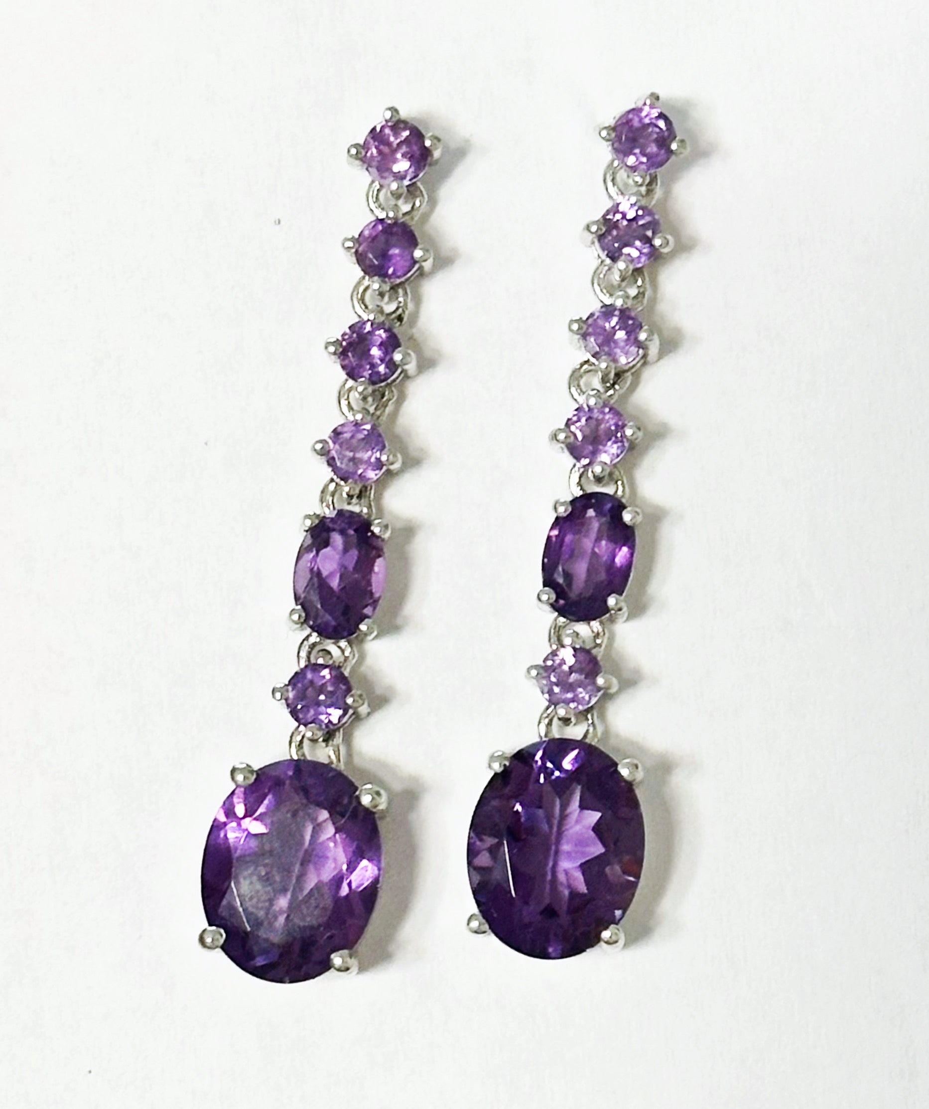Sterling silver dangle earrings with amethysts
