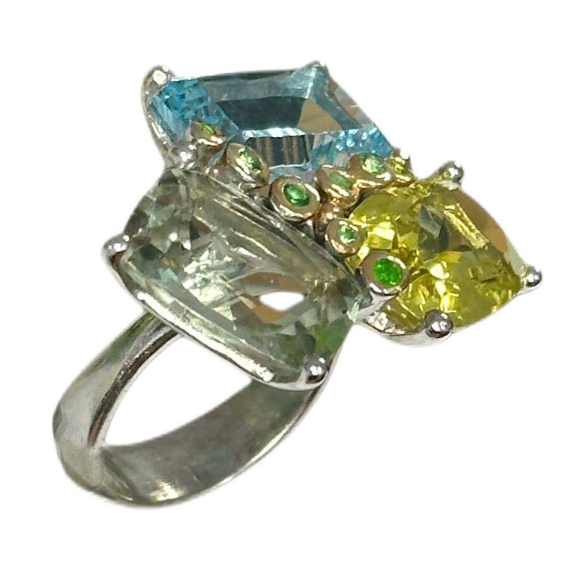 Ring with multicolored gemstones on a white background