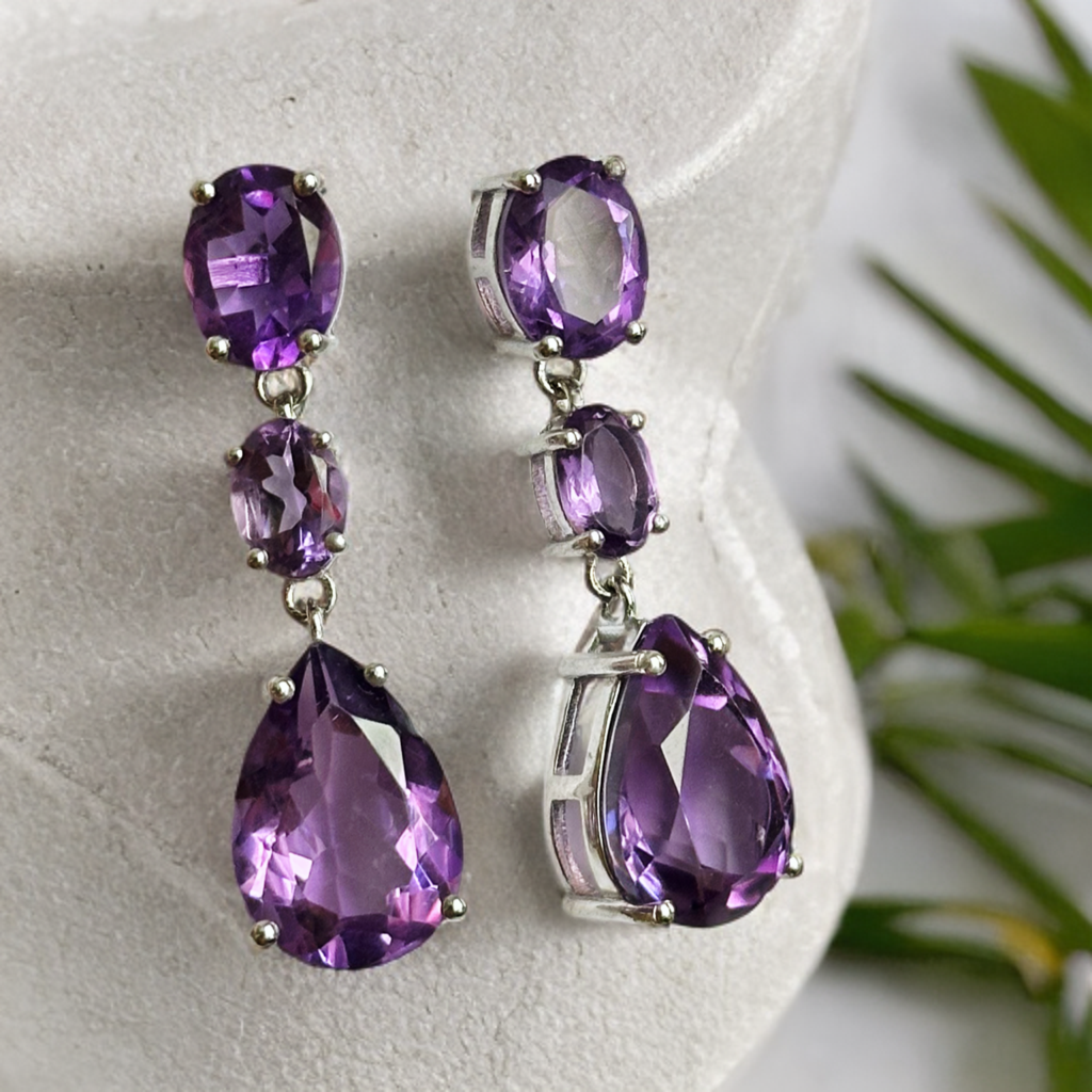 White rhodium plated sterling silver dangle earrings with natural amethysts