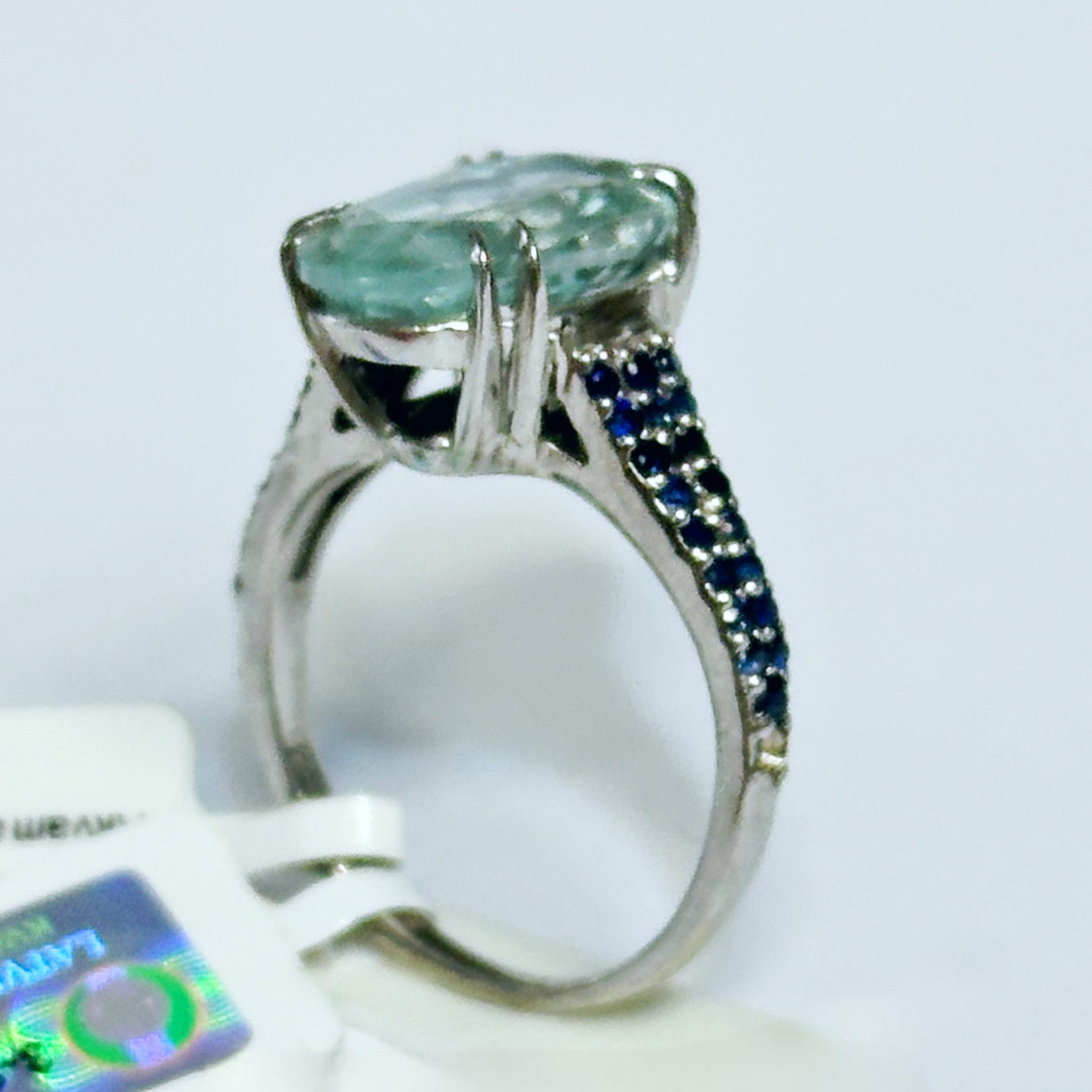 white rhodium plated Sterling silver ring with aquamarine and blue sapphires