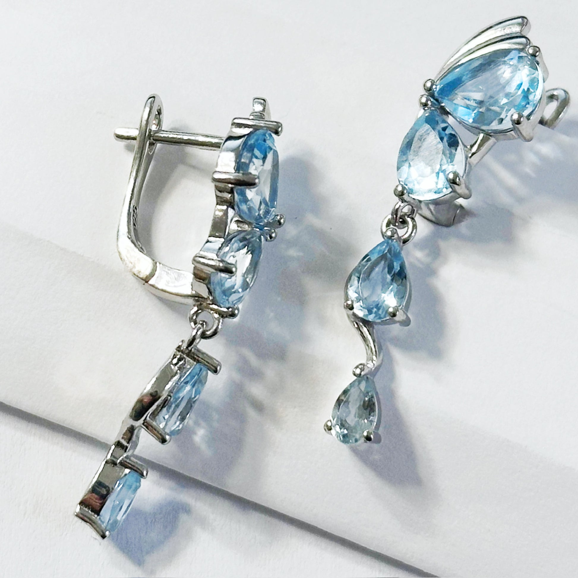 Butterfly wing Sterling silver English lock earrings with natural blue topazes