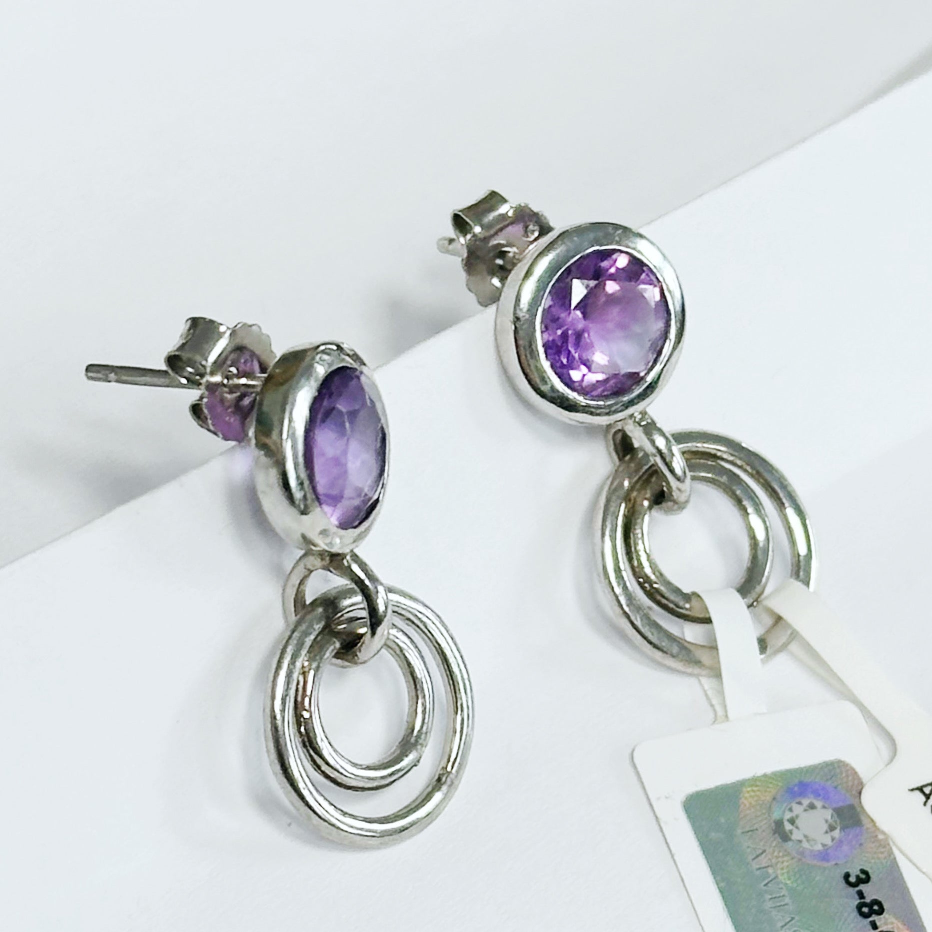 Geometric sterling silver stud earrings with amethysts