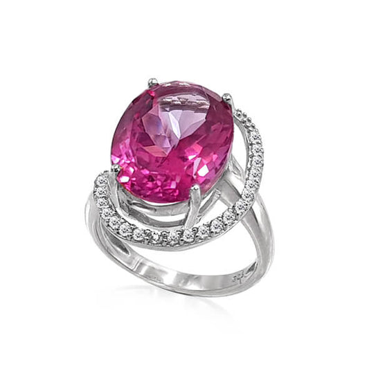 A sterling silver ring with a large pink topaz centerpiece and small white topazes around the band.